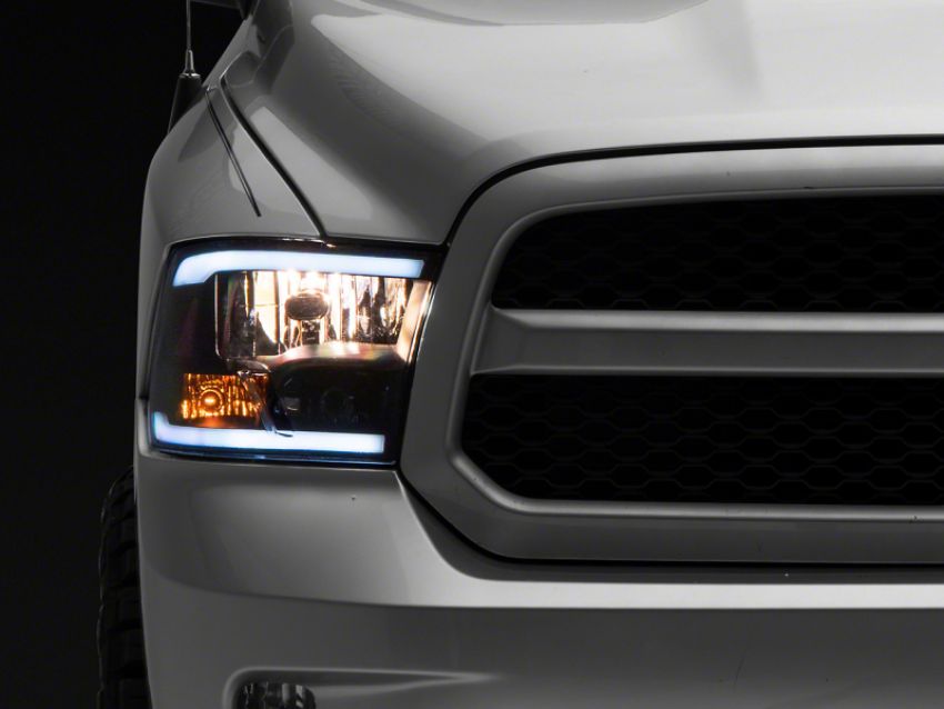 Raxiom R131482 09-18 Dodge RAM 1500/2500/3500 Axial Headlights w/ SEQL LED Bar- Blk Housing (Clear Lens)