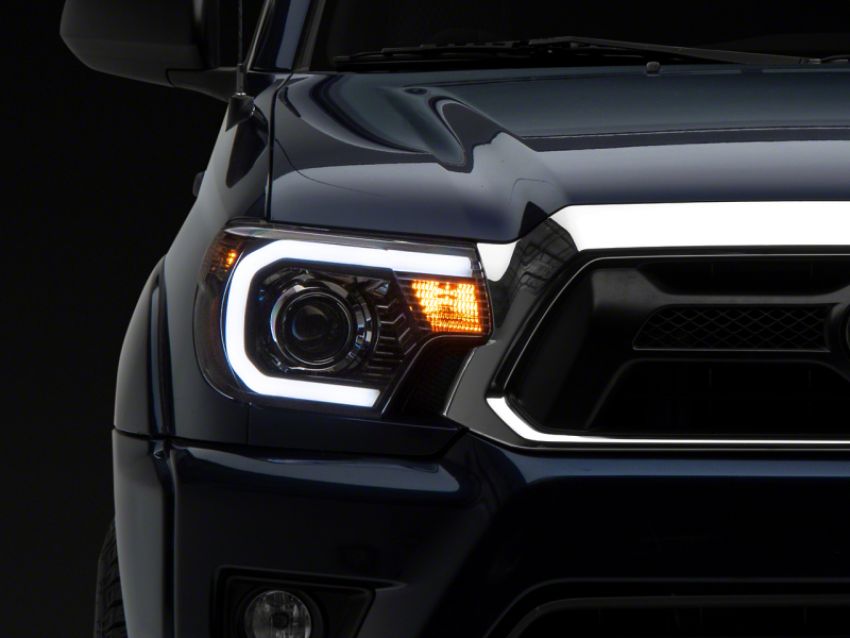 Raxiom TT21850 12-15 Toyota Tacoma Axial Projector Headlights w/ SEQL LED Bar- Blk Housing (Clear Lens)