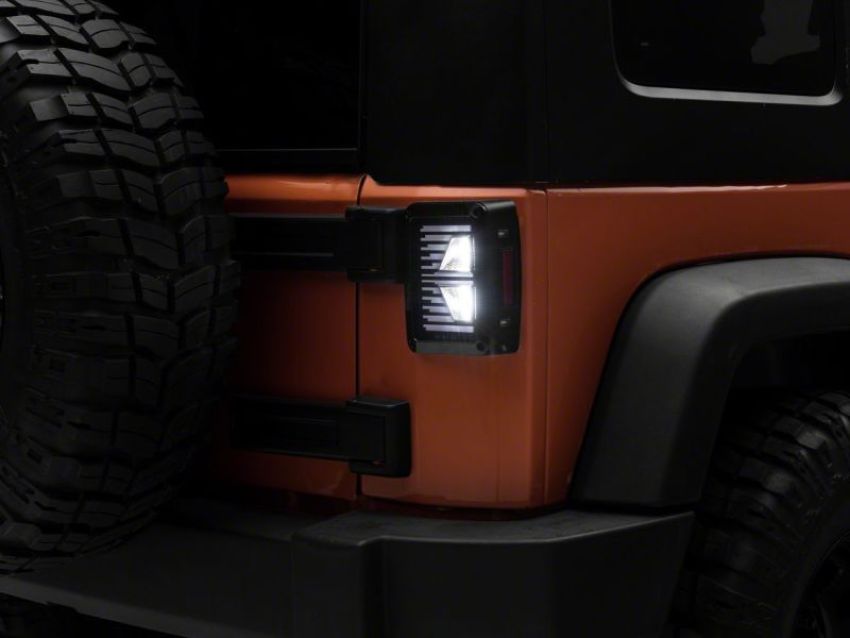 Raxiom J130809 07-18 Jeep Wrangler JK Axial Series Vision LED Tail Lights- Blk Housing (Clear Lens)