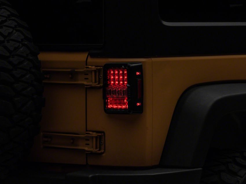 Raxiom J141596 07-18 Jeep Wrangler JK Axial Series Lux LED Tail Lights- Blk Housing (Clear Lens)