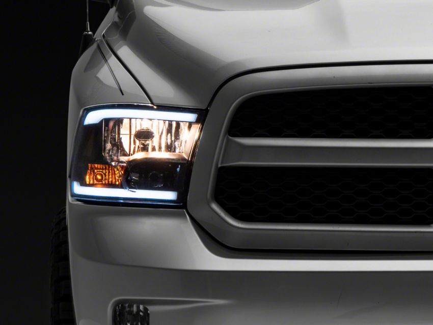 Raxiom R131481 09-18 Dodge RAM 1500/2500/3500 Axial Series Headlights w/ LED Bar- Blk Housing (Clear Lens)