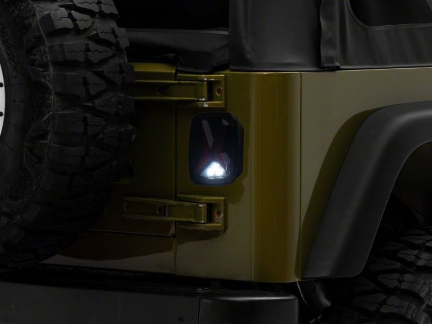 Raxiom J177410 76-06 Jeep CJ7 Wrangler YJ & TJ Gladiator LED Tail Lights- Blk Housing (Smoked Lens)