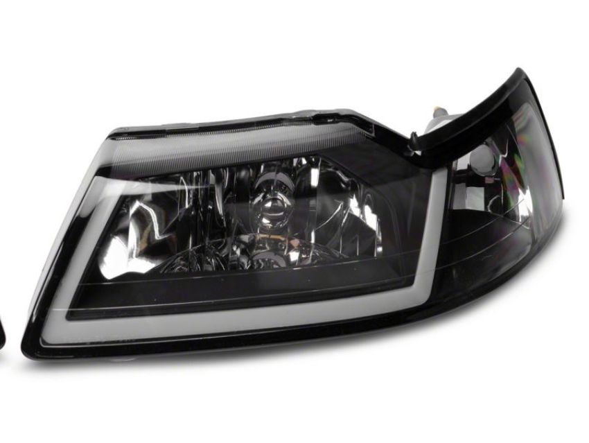 Raxiom 422712 99-04 Ford Mustang Axial Series Headlights w/ LED Bar- Blk Housing (Clear Lens)