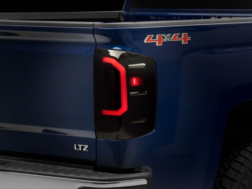 Raxiom S151298 14-18 Chevrolet Silverado 1500 Axial Series LED Tail Lights- Blk Housing (Smoked Lens)
