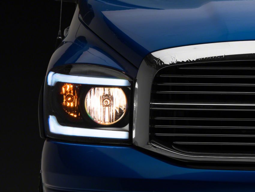 Raxiom R131480 06-09 Dodge RAM 1500/2500/3500 Axial Headlights w/ SEQL LED Bar- Blk Housing (Clear Lens)