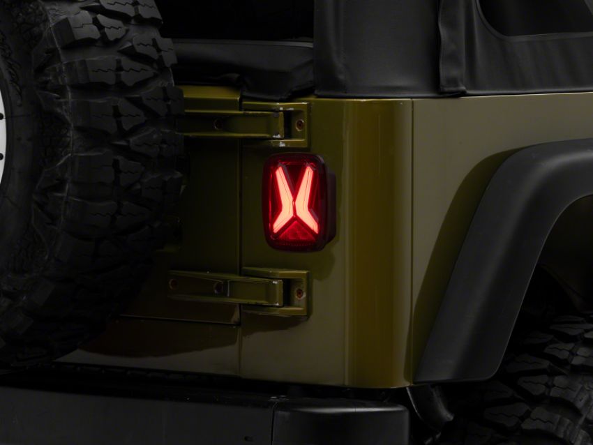 Raxiom J177410 76-06 Jeep CJ7 Wrangler YJ & TJ Gladiator LED Tail Lights- Blk Housing (Smoked Lens)